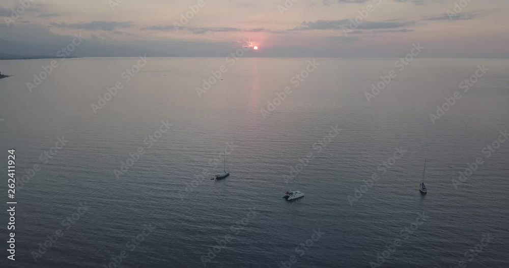 boats out on the sea with a sunset boats out on the sea with a sunset