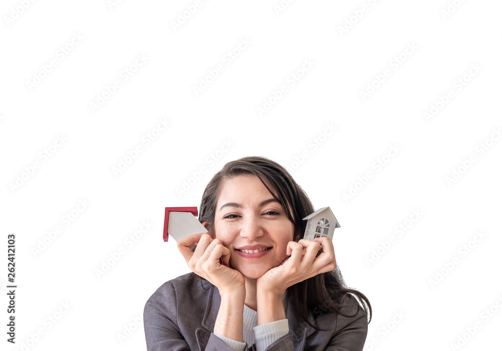 Happiness smiley young woman holding two small wooden mock up homes model in hands isolated on white background . Choice of Mortgage property insurance and business real estate concept. Happiness smiley young woman holding two small wooden mock up homes model in hands isolated on white background . Choice of Mortgage property insurance and business real estate concept.