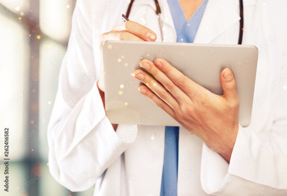Close-up Doctor at hospital working with tablet pc Close-up Doctor at hospital working with tablet pc