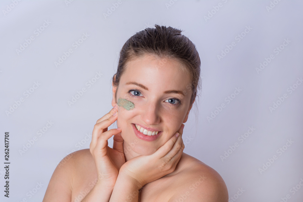 Young woman applying foundation powder. Young woman applying foundation powder.