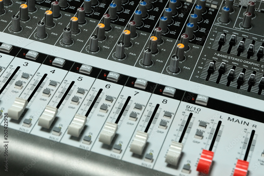 Mixing console close-up. Sound check for the concert. Mixer control. Music equipment and technology concept. Mixing console close-up. Sound check for the concert. Mixer control. Music equipment and technology concept.