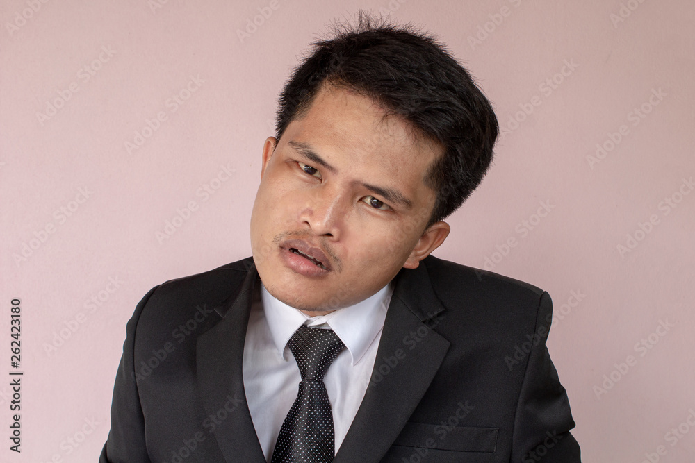 portrait of a businessman angry on pink background. portrait of a businessman angry on pink background.