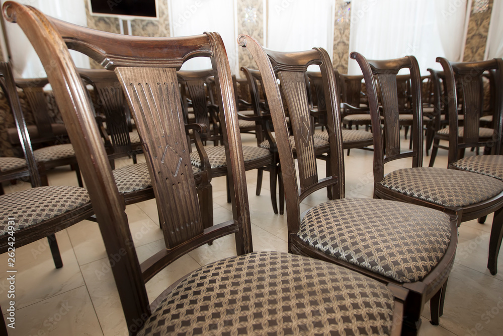 Wooden chairs in the conference room