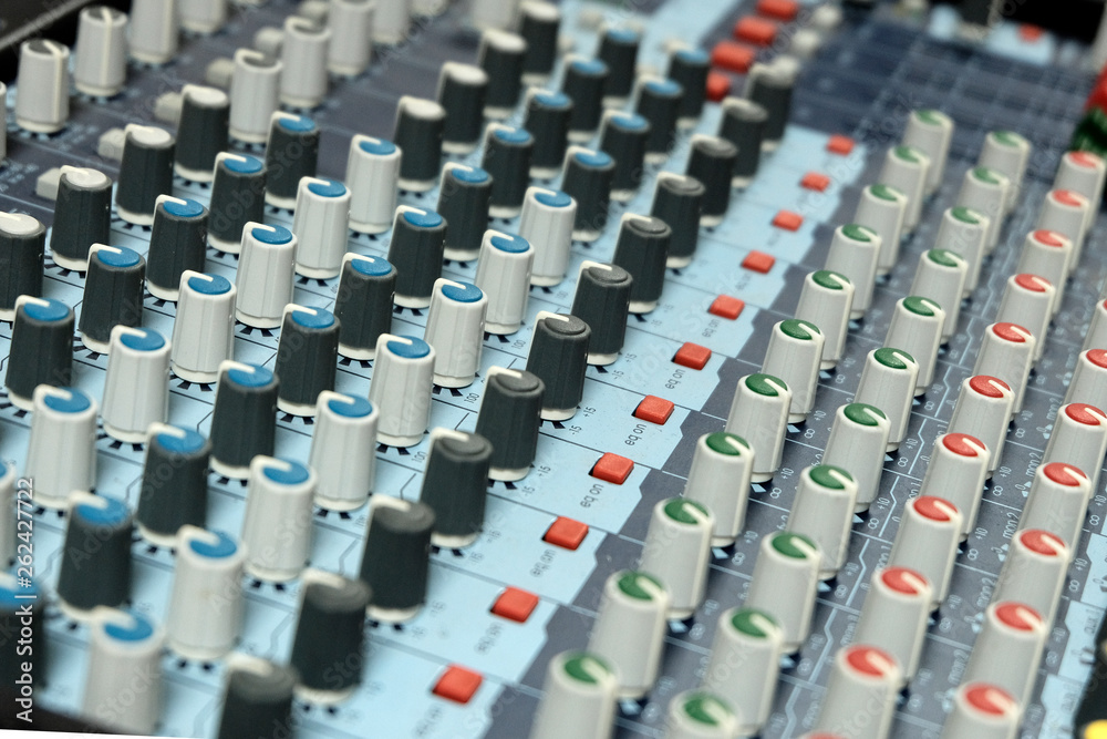 Mixing console close-up. Blurry. Sound check for the concert. Mixer control. The concept of music equipment and technology.