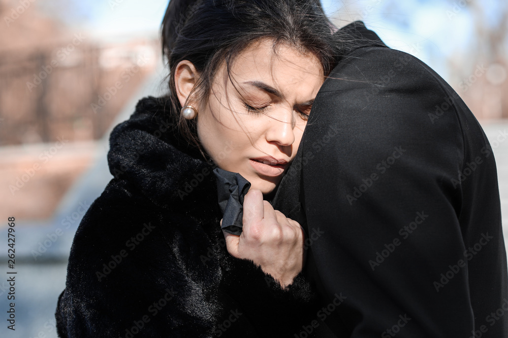 Couple pining after their relative at funeral Couple pining after their relative at funeral