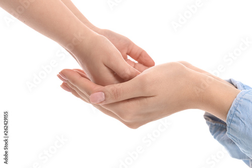 Hands of woman and child on white background