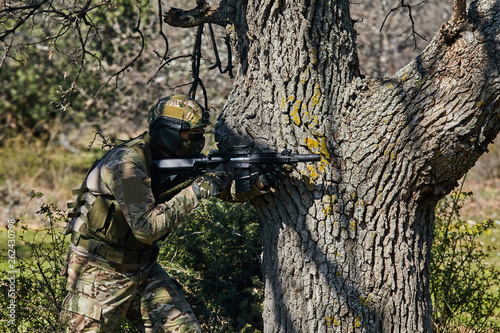 Armed soldier ready for battle. Military concept.Playing air soft.