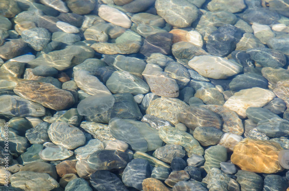 Background of sea colored stones under water. Background of sea colored stones under water.