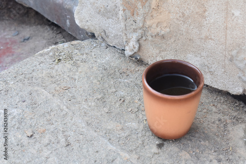 Clay Cup with drink. © Aksana