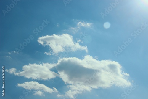 World-outlook. Many small clouds in the light of the sun in the spring sky. the concept of ecology of life