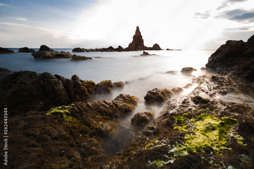 Spain, Almería, Cabo de Gata, Sirens Reef (Arrecife de las sirenas) - Long exposure on sunset, sea and silk effect on the water