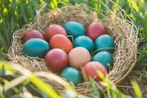 basket with painted colorful easter eggs 