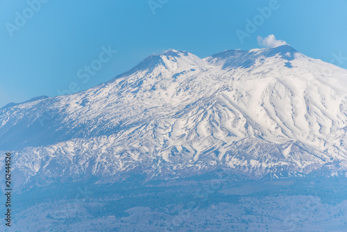 View of Snow Capped Mt. Etna at Sunset from Sicily, Italy © JonShore
