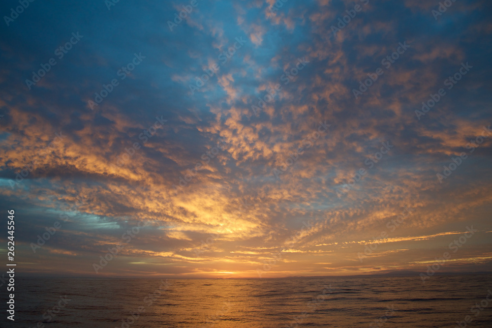 sunset over the sea with illuminated clouds sunset over the sea with illuminated clouds