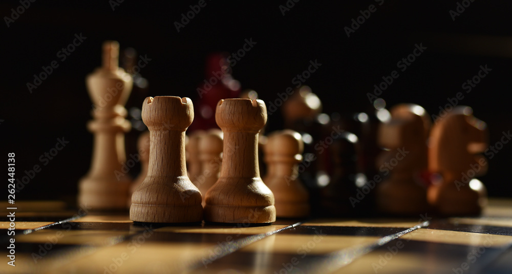 wooden chess set on chess Board