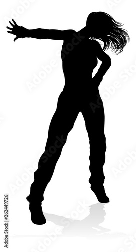 A woman street dance hip hop dancer in silhouette
