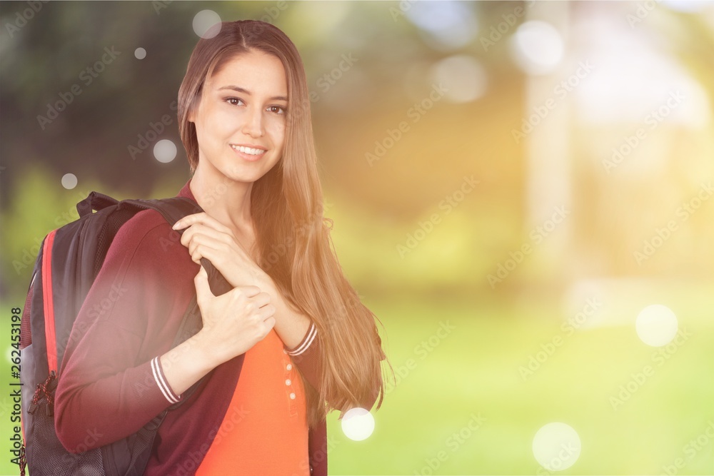 Young smilling female college student with backpack Young smilling female college student with backpack