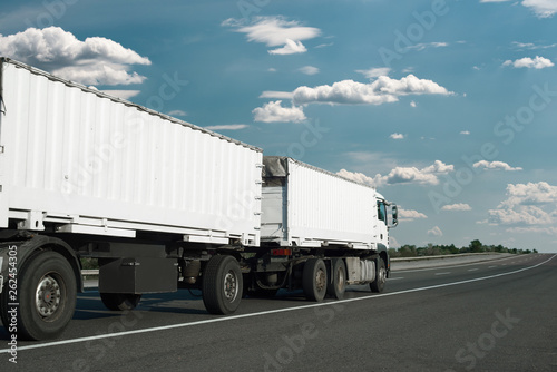 The white truck is going up the road. Cargo transportation concept.