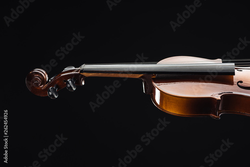 close up of classical wooden violoncello isolated on black