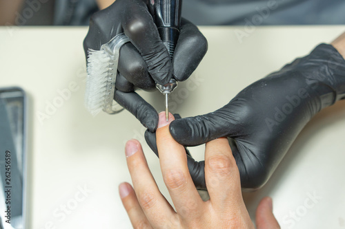 close up of manicurist hands and client