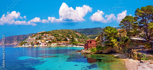 Beautiful landscape with bay and colorful buildings on the background of picturesque clouds in the town of Asos, Greece, Kefalonia. Wonderful exciting places.