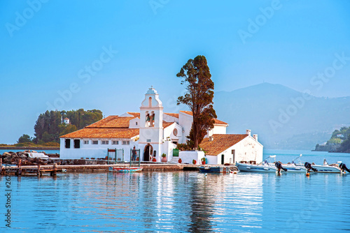 Nice optimistic bright view of Vlacherna Monastery on the Kanoni peninsula in Kerkyra, Corfu, Greece. popular tourist attractions. amazing places. photo