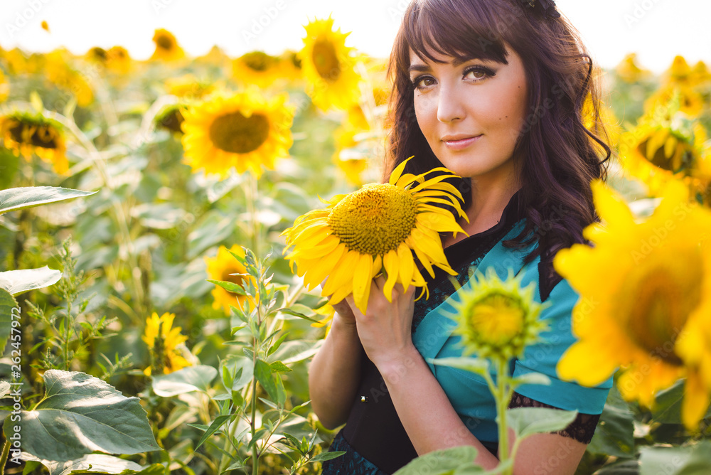 Happy woman in beauty field with sunflowers Happy woman in beauty field with sunflowers