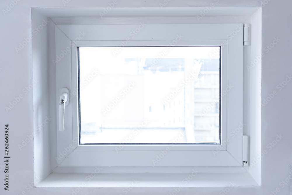 white plastic PVC window indoors close-up