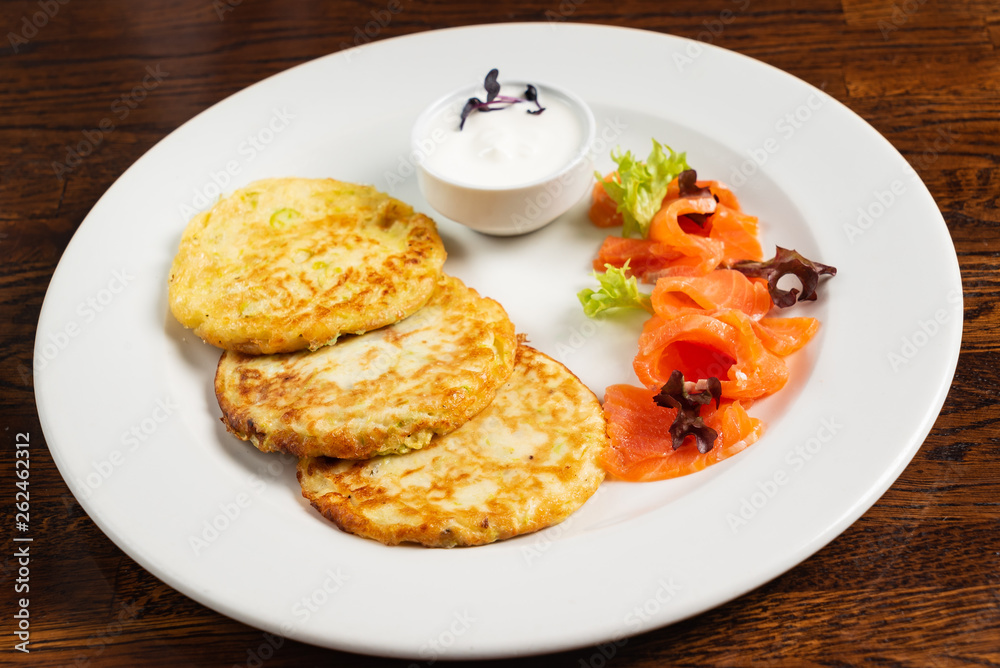 potato pancakes with smoked salmon and sour cream