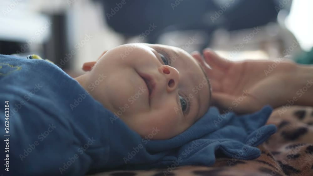 Close-up. Mother touches little son's chin and nose Close-up. Mother touches little son's chin and nose