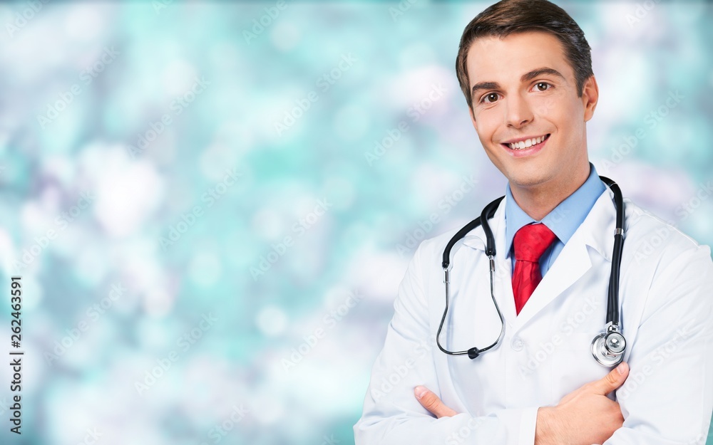Male doctor with stethoscope smiling at camera Male doctor with stethoscope smiling at camera