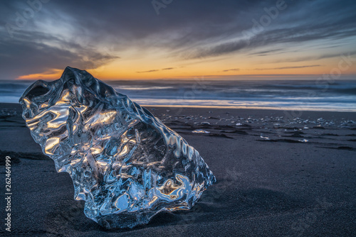 Photos A big block of ice on the beach at sunrise, near the Jokulsarlon lagoon in South