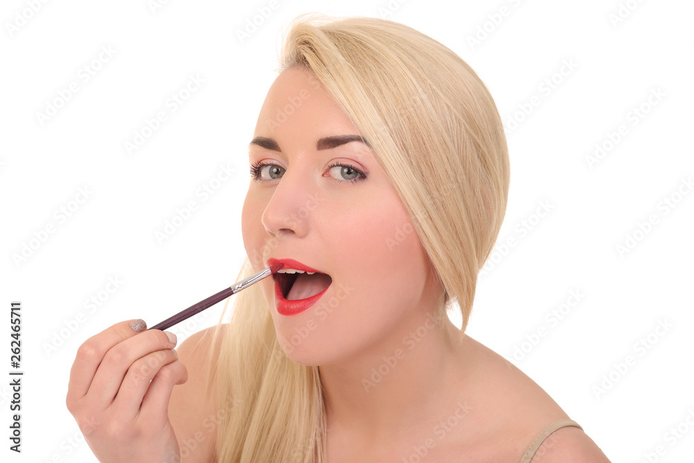 young woman applying lips makeup with cosmetic brush young woman applying lips makeup with cosmetic brush