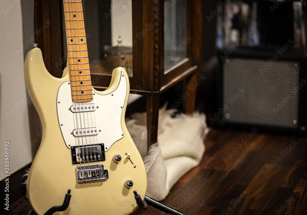 Classic look electric guitar with amplifier in the back