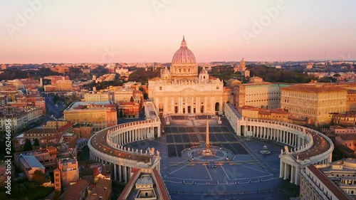 rome aerial shot drone fly orbit on st peter square basilica at sunrise photo