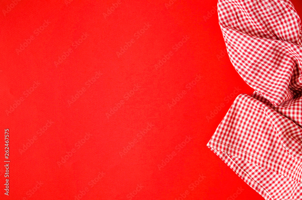 Fototapeta premium Kitchen textiles on bright red background