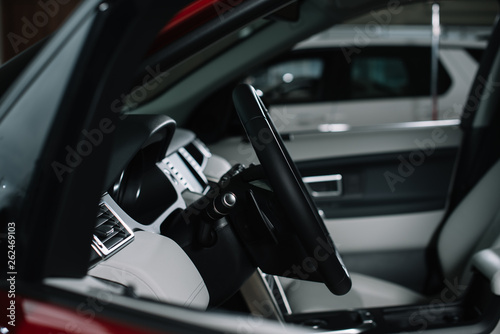 selective focus of black steering wheel in modern automobile © LIGHTFIELD STUDIOS