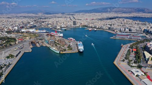 Aerial drone bird's eye view of famous crowded port of Piraeus one of the largest in Europe where ships travel to popular Aegean destinations, Attica, Greece