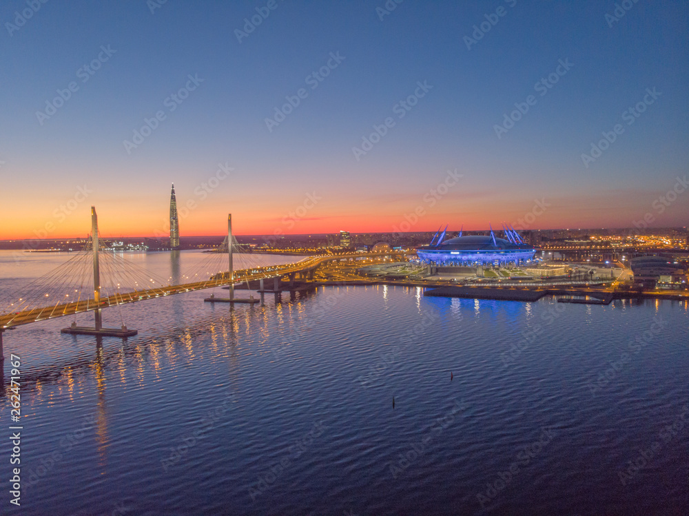 Saint-Petersburg, Russia. Aerial views to Gulf Finland. Skyscraper Lakhta center Gazprom headquarters. Stadium Zenith Arena at night. Illuminated by multi-colored lights the stadium at night.