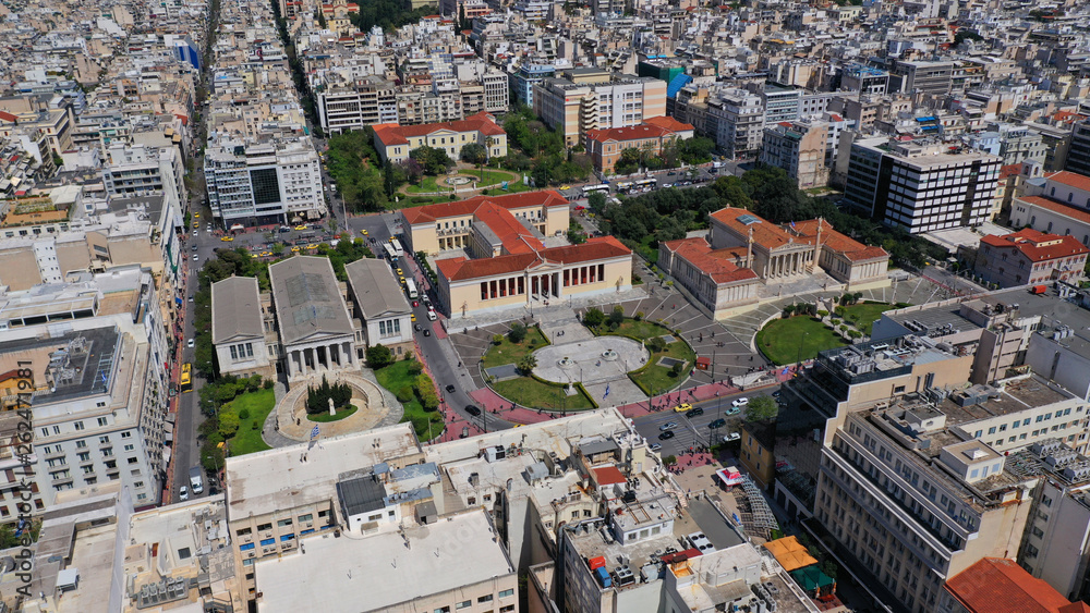 Aerial drone photo of trilogy neoclassic buildings, Academy of Athens, University and public library and Lycabettus hill at the background, Athens, Attica, Greece Aerial drone photo of trilogy neoclassic buildings, Academy of Athens, University and public library and Lycabettus hill at the background, Athens, Attica, Greece