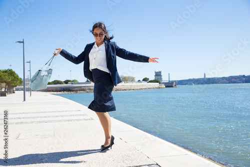 Cheerful business lady celebrating success