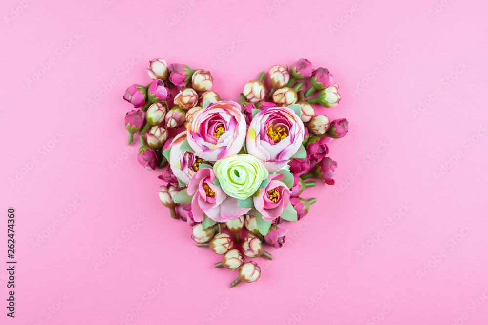 Heart of flowers on a pink background. Heart of flowers on a pink background.