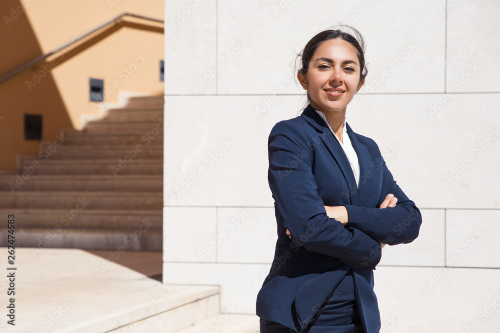 Positive confident professional posing on outdoor stairs Positive confident professional posing on outdoor stairs