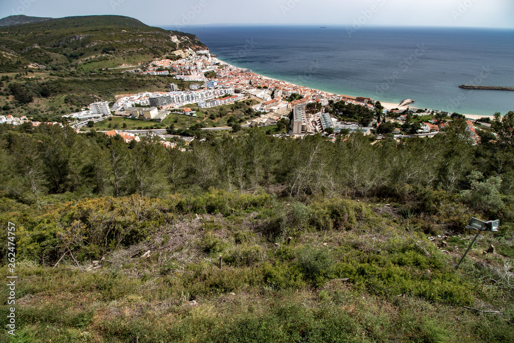 aerial view of Sesimbra village with blue sky and white clouds in the background