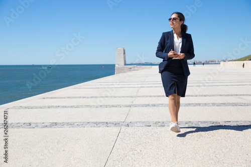 Fototapeta Naklejka Na Ścianę i Meble -  Positive office worker admiring seascape