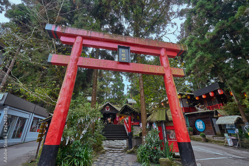 Nantou, Taiwan - December 7, 2018: Beautiful red Torii gate in front of Xitou monster village at Xitou of Nantou Lugu in Taiwan . Nantou, Taiwan - December 7, 2018: Beautiful red Torii gate in front of Xitou monster village at Xitou of Nantou Lugu in Taiwan .