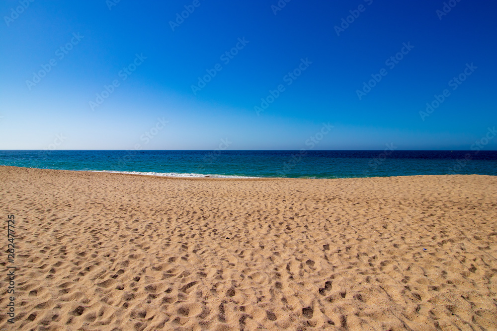 golden sand sea and blue sky