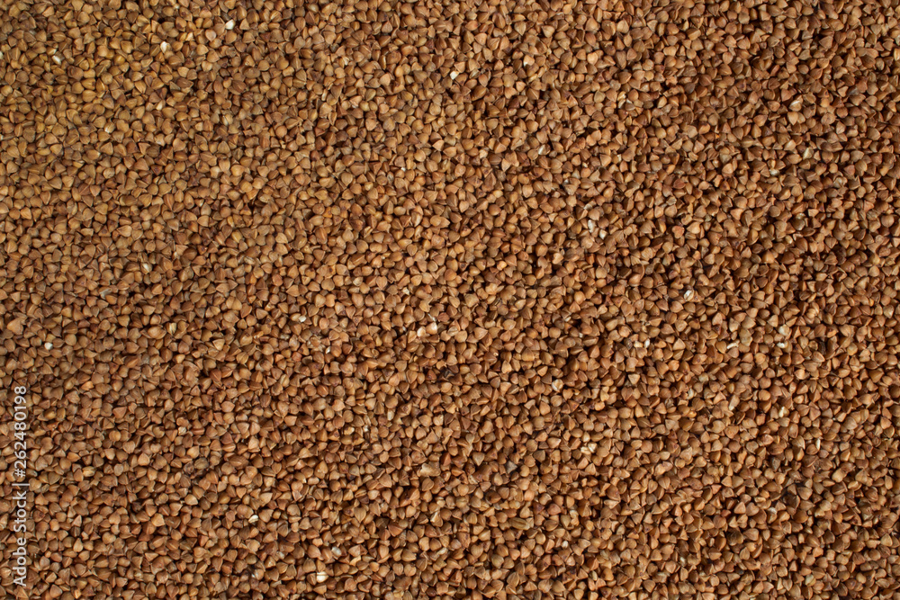Background of buckwheat. The texture of the buckwheat. Background of buckwheat. The texture of the buckwheat.