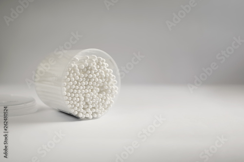 A lot of cotton sticks on a white background.