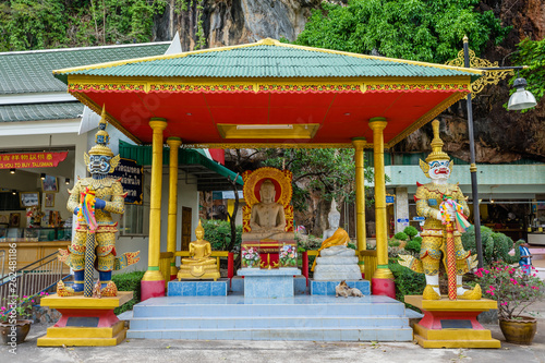 Yaksha and Buddha statues at the Wat Tham Sua or Tiger Cave Temple iin Krabi province photo